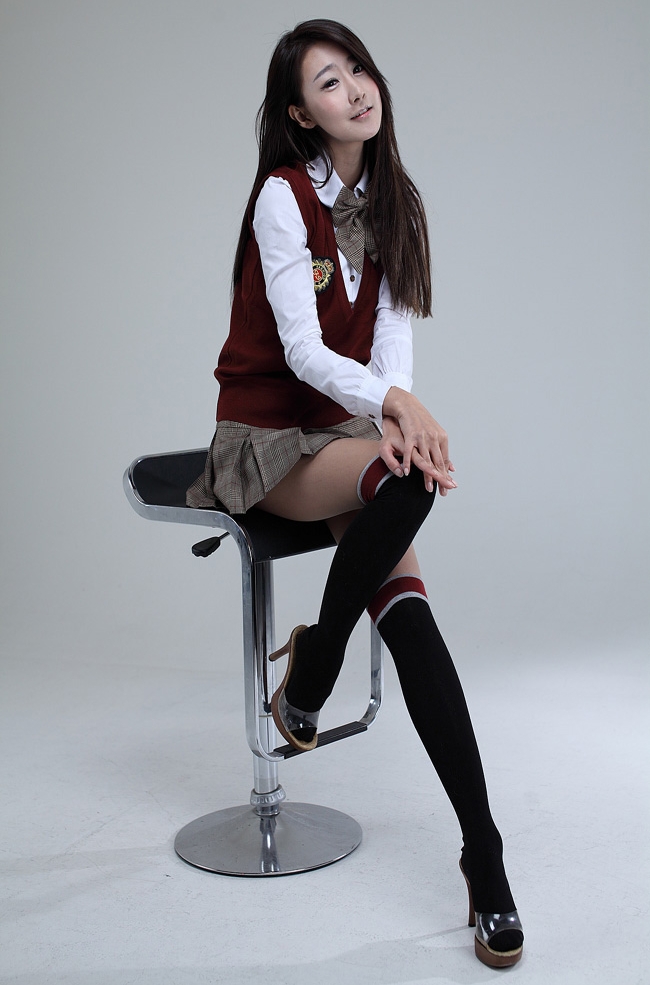 Brunette Asian Schoolgirl wearing Black Kneehigh Socks and Grey Tartan Miniskirt